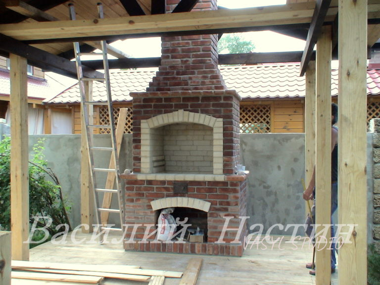 Outdoor grill fireplace made of old brick