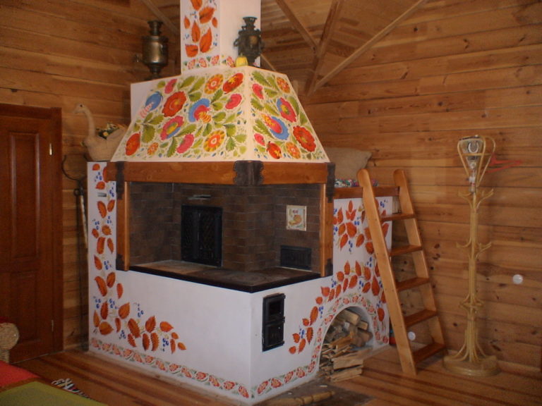 General view of a painted stove in the interior, decorated in the style of Ukrainian Petrykivka painting